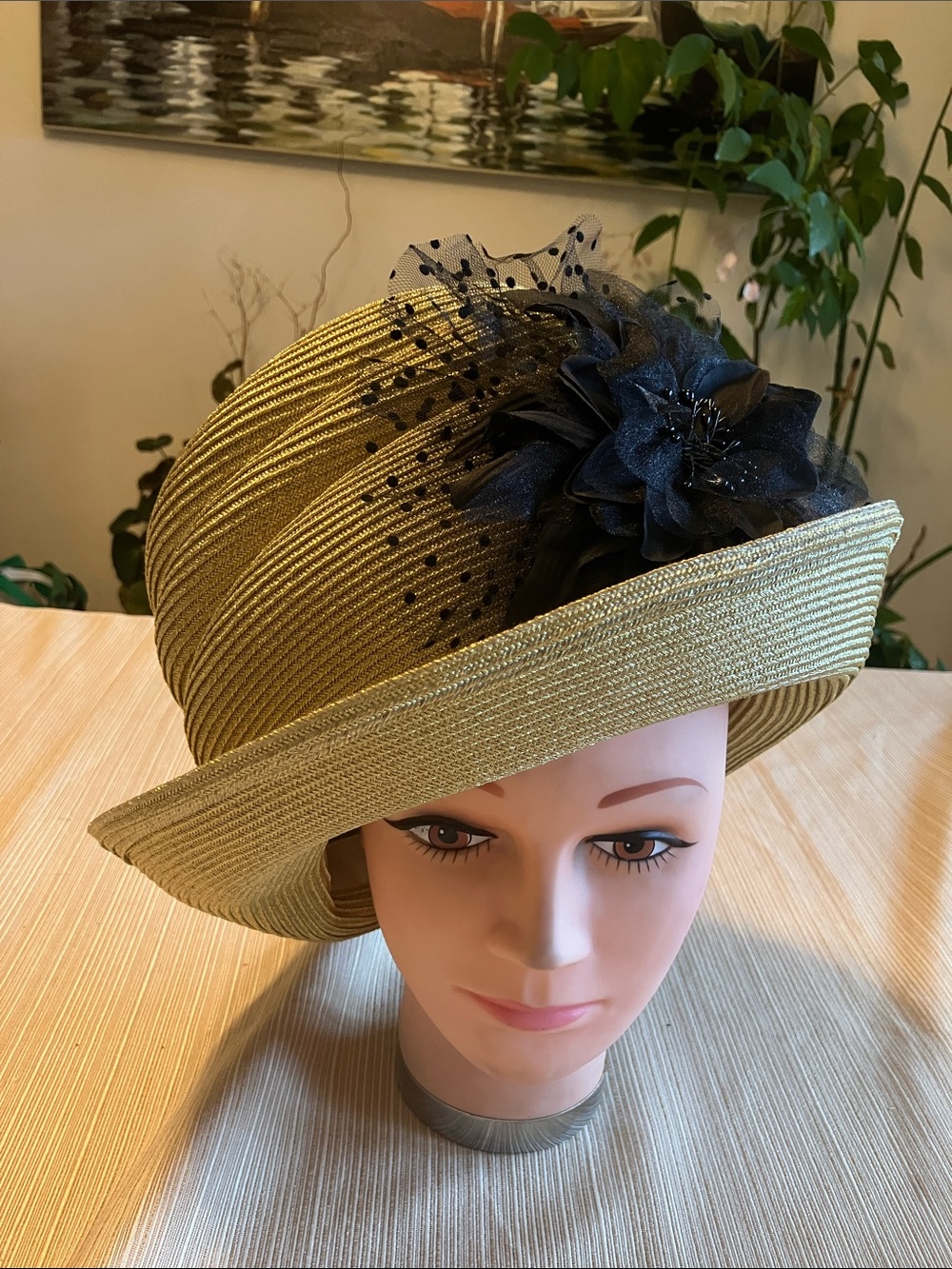 Elegant Metallic Gold Madhatter Hat with Black Flower Accent